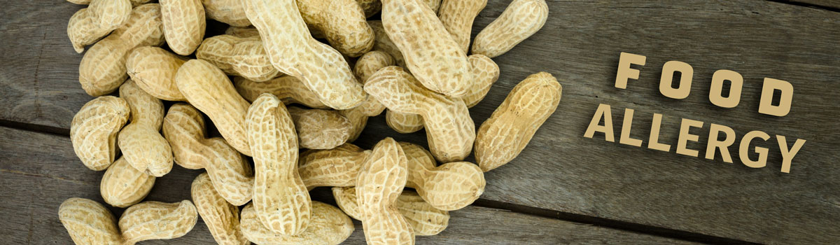shelled peanuts on a wood table Colorado Allergy & Asthma Centers
